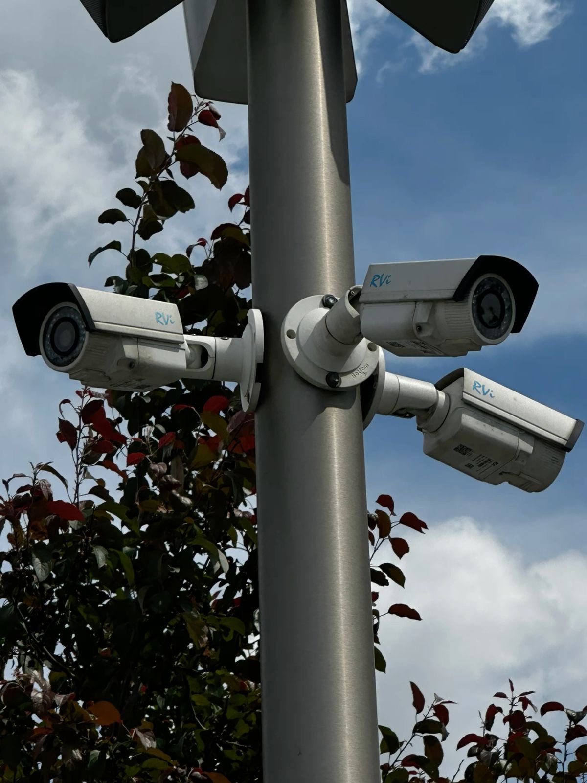 Logistics hub yard with surveillance cameras.